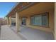 Large covered back patio with a sliding glass door entry at 1257 N 166Th Ave, Goodyear, AZ 85338