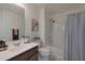 Bathroom featuring a single sink vanity and shower-tub combo at 1257 N 166Th Ave, Goodyear, AZ 85338