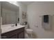 Well-lit bathroom featuring a vanity, toilet, and shower-tub combination at 1257 N 166Th Ave, Goodyear, AZ 85338