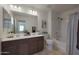 Bathroom featuring a double sink vanity and shower-tub combo at 1257 N 166Th Ave, Goodyear, AZ 85338