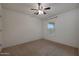 Bright bedroom features carpeted floors and natural light from a window at 1257 N 166Th Ave, Goodyear, AZ 85338