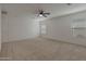 Large bedroom with a ceiling fan and carpeted floor at 1257 N 166Th Ave, Goodyear, AZ 85338