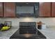 Close-up of a well-maintained kitchen with modern appliances and stylish countertops at 1257 N 166Th Ave, Goodyear, AZ 85338