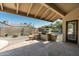 Outdoor patio with built-in grill, stone floors, and covered sitting area great for outdoor entertaining at 14401 N 60Th Pl, Scottsdale, AZ 85254