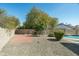 The serene backyard is a blank canvas with mature trees and a large, inviting patio space at 14401 N 60Th Pl, Scottsdale, AZ 85254