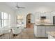 Modern kitchen with granite countertops, white cabinets, and stainless steel microwave, plus an adjacent breakfast nook at 14401 N 60Th Pl, Scottsdale, AZ 85254