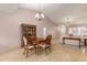 Elegant dining room featuring a classic wood table, china cabinet, and views into the living space at 1549 E Westchester Dr, Chandler, AZ 85249