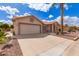 Attractive single-story house featuring a two-car garage, desert landscaping, and a tile roof at 1549 E Westchester Dr, Chandler, AZ 85249