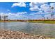 Scenic pond with a fountain, surrounded by landscaping and homes, creating a serene community view at 1549 E Westchester Dr, Chandler, AZ 85249