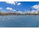 Outdoor tennis court with a blue surface, promising active recreation in a sunny environment at 1549 E Westchester Dr, Chandler, AZ 85249