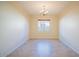 Bright and airy dining room featuring neutral paint and tile flooring, awaiting personalization at 16089 W Harvard St, Goodyear, AZ 85395