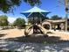 Community playground with shade structure and play equipment offers outdoor fun at 16089 W Harvard St, Goodyear, AZ 85395