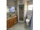 A small dated bathroom with a shower, sink, and toilet at 1616 E Pecan Rd, Phoenix, AZ 85040