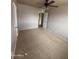 Bedroom with wall-to-wall carpeting, a ceiling fan, and neutral-colored walls at 1616 E Pecan Rd, Phoenix, AZ 85040