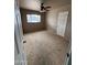 Bedroom with a window, carpeting, a ceiling fan, and neutral-colored walls at 1616 E Pecan Rd, Phoenix, AZ 85040