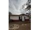 Rear exterior view of home, displaying a combination of brick and siding and a well-maintained yard at 1616 E Pecan Rd, Phoenix, AZ 85040