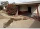 Charming single-story home featuring a covered carport, blooming bougainvillea, and sidewalk at 1616 E Pecan Rd, Phoenix, AZ 85040