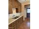 Traditional kitchen featuring wood cabinetry and tile countertops at 1616 E Pecan Rd, Phoenix, AZ 85040