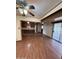 Open concept living room open to the kitchen featuring wood-look flooring and lots of natural light at 1616 E Pecan Rd, Phoenix, AZ 85040