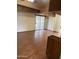 Open concept living room open to the kitchen featuring wood-look flooring and sliding door to back at 1616 E Pecan Rd, Phoenix, AZ 85040