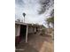 View of the covered patio that is paved with brick, offering a cozy and shaded outdoor living space at 1616 E Pecan Rd, Phoenix, AZ 85040