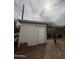 Exterior shed with white siding providing additional storage space in the backyard at 1616 E Pecan Rd, Phoenix, AZ 85040