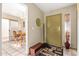 Bright foyer with tile flooring, storage closet, and a view into the adjacent dining room at 1632 Leisure World --, Mesa, AZ 85206