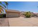 Street view of a single-story home featuring a two-car garage and desert landscaping with a long driveway at 1632 Leisure World --, Mesa, AZ 85206