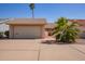 Charming single-story home featuring a two-car garage, low maintenance landscaping, and inviting curb appeal at 1632 Leisure World --, Mesa, AZ 85206