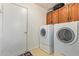 Laundry room with a washer and dryer and overhead cabinets for storage at 1632 Leisure World --, Mesa, AZ 85206