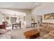 Spacious living room featuring vaulted ceilings, neutral colors, and a view into the adjacent dining area at 1632 Leisure World --, Mesa, AZ 85206