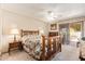 Bedroom featuring a ceiling fan, neutral walls, and private access to the outdoors at 1632 Leisure World --, Mesa, AZ 85206