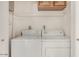 Functional laundry area with washer and dryer, plus convenient overhead storage at 16402 N 31St St # 107, Phoenix, AZ 85032