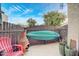 Cozy outdoor patio space with a colorful chair, decorative chiminea, and stylish potted plants at 16402 N 31St St # 107, Phoenix, AZ 85032