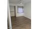 Bedroom with hardwood floors, ceiling fan, and closet at 16402 N 31St St # 117, Phoenix, AZ 85032