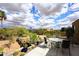 Beautiful backyard with a patio set overlooking the desert landscape and a distant mountain range at 16920 E Monterey Dr, Fountain Hills, AZ 85268