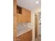 Lovely butler's pantry with tiled backsplash and light wood cabinets at 16920 E Monterey Dr, Fountain Hills, AZ 85268