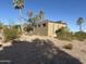 Unique exterior elevation of a mid-century modern house with palm trees and desert landscaping at 16920 E Monterey Dr, Fountain Hills, AZ 85268