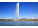 Picturesque fountain on the lake, set against a backdrop of desert homes and mountains at 16920 E Monterey Dr, Fountain Hills, AZ 85268