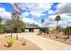 Stunning desert home with an American flag, gorgeous landscaping, and circular driveway at 16920 E Monterey Dr, Fountain Hills, AZ 85268