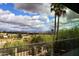 Scenic view from a balcony showing a beautiful landscape with mountains and lush vegetation under a partly cloudy sky at 16920 E Monterey Dr, Fountain Hills, AZ 85268