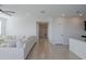 Bright living room featuring recessed lighting and an open layout, complemented by neutral decor at 17487 W Daley Ln, Surprise, AZ 85387