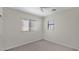 Carpeted bedroom with ceiling fan and natural light from windows at 17655 W Tasha Dr, Surprise, AZ 85388