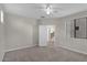 Bright bedroom featuring carpet flooring, neutral walls, and a window with blinds at 17655 W Tasha Dr, Surprise, AZ 85388