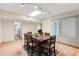 Dining area with a large table, chandelier, and access to the kitchen, perfect for hosting at 18018 N Highwood Ct, Sun City, AZ 85373