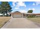 Attractive single-story residence boasting a well-kept lawn, mature landscaping, and an attached two-car garage at 18018 N Highwood Ct, Sun City, AZ 85373