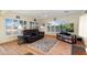 Inviting sunroom featuring bright windows, wood floors, and comfortable seating for a relaxing atmosphere at 18018 N Highwood Ct, Sun City, AZ 85373