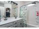 The bathroom features a double sink vanity, modern fixtures, and a shower-tub combination with a stylish shower curtain at 18250 N Cave Creek Rd # 164, Phoenix, AZ 85032