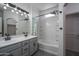 Bathroom with a double sink vanity, tub, and shower showcasing modern fixtures at 18250 N Cave Creek Rd # 164, Phoenix, AZ 85032