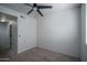 A simple bedroom with neutral paint, carpet and a ceiling fan at 18250 N Cave Creek Rd # 164, Phoenix, AZ 85032